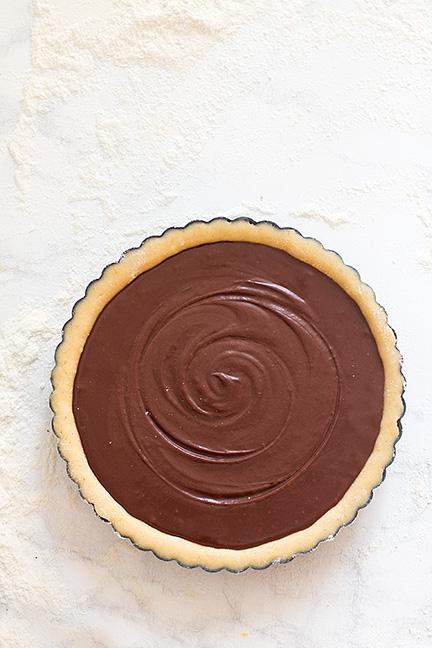 Guscio di frolla all'arancia e ripieno di cioccolato alla cannella - Ricetta Crostata di Natale